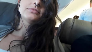 Hot babe masturbating inside the plane