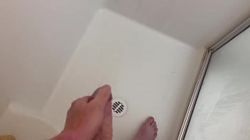 Masterbating in the shower, turned the heat up so it hurts as it hits my cock.. watch me cum..