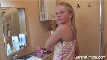 Sweet Sarah strip off her clothes and showing natural tits and shaved pussy. She Fingering her pussy deeply in comport room